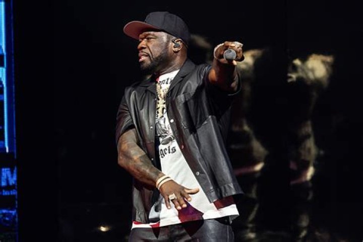 50 Cent throws mic in a crowd in anger, fan smacked in the head