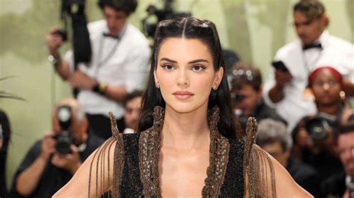 Kendall Jenner Stuns In Brown Maxi Dress With Slicked Hair Look