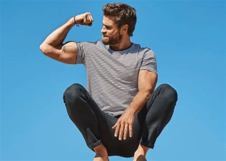 Liam Hemsworth Shows Off His Muscles As He Covers Men’s Health